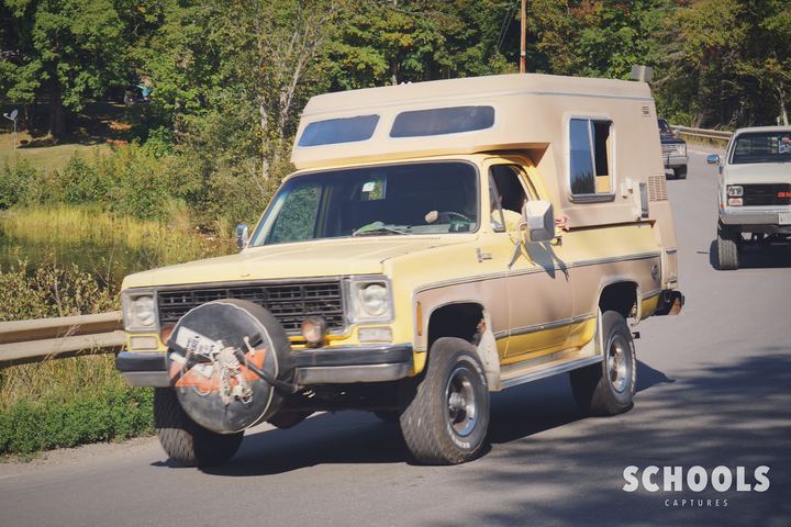 Tan GMC with camper shell